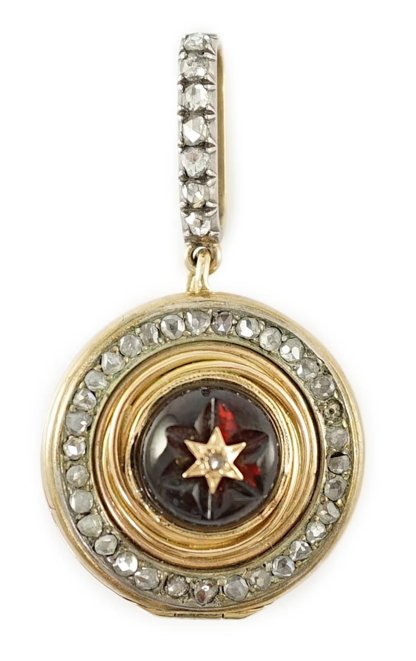 A 19th century gold, cabochon garnet and rose cut diamond set cluster target pendant